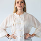 Amelia milk relaxed shirt, front view with hands on hips