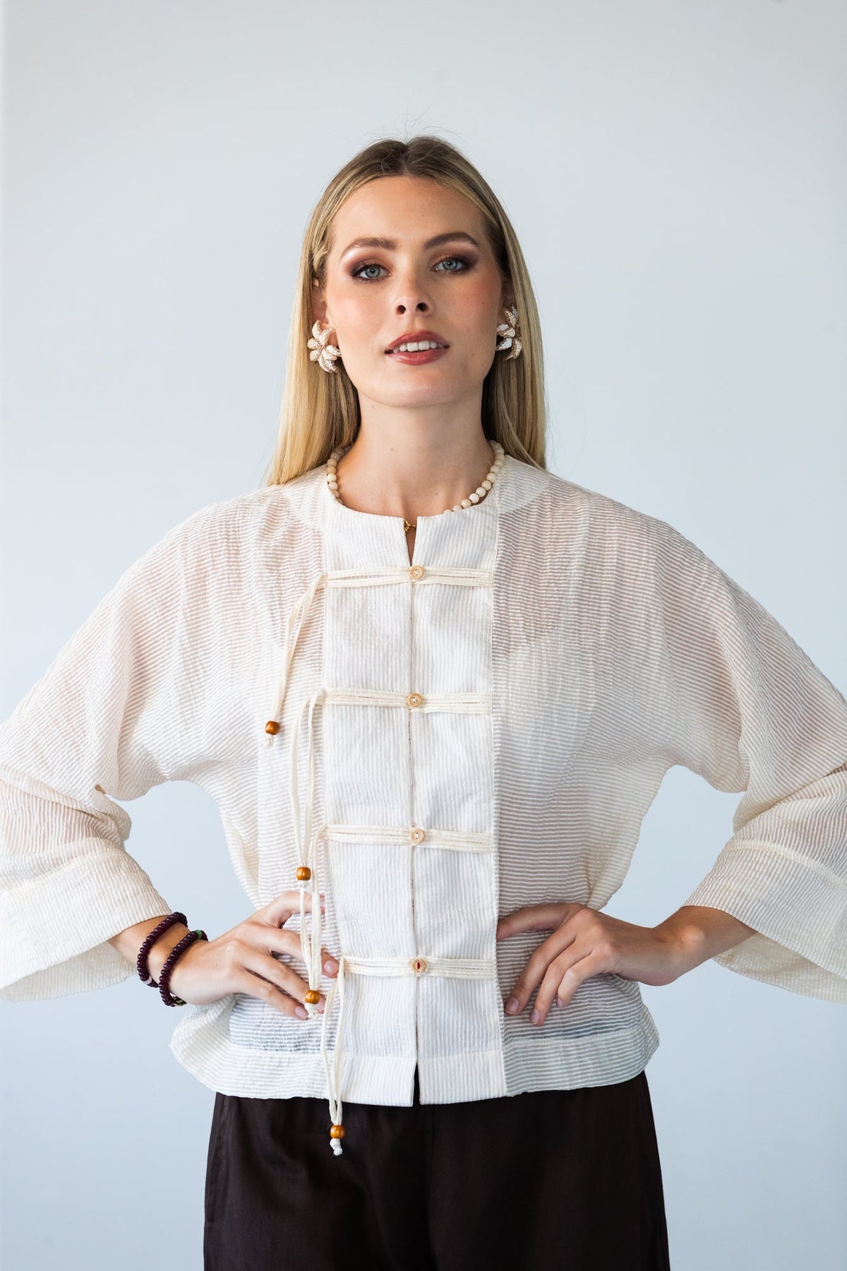 Amelia milk relaxed shirt, front view with hands on hips