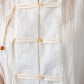Amelia milk relaxed shirt, close up of neckline and toggle closures