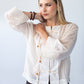 Amelia milk relaxed shirt, close up of sleeve cuff with bracelets
