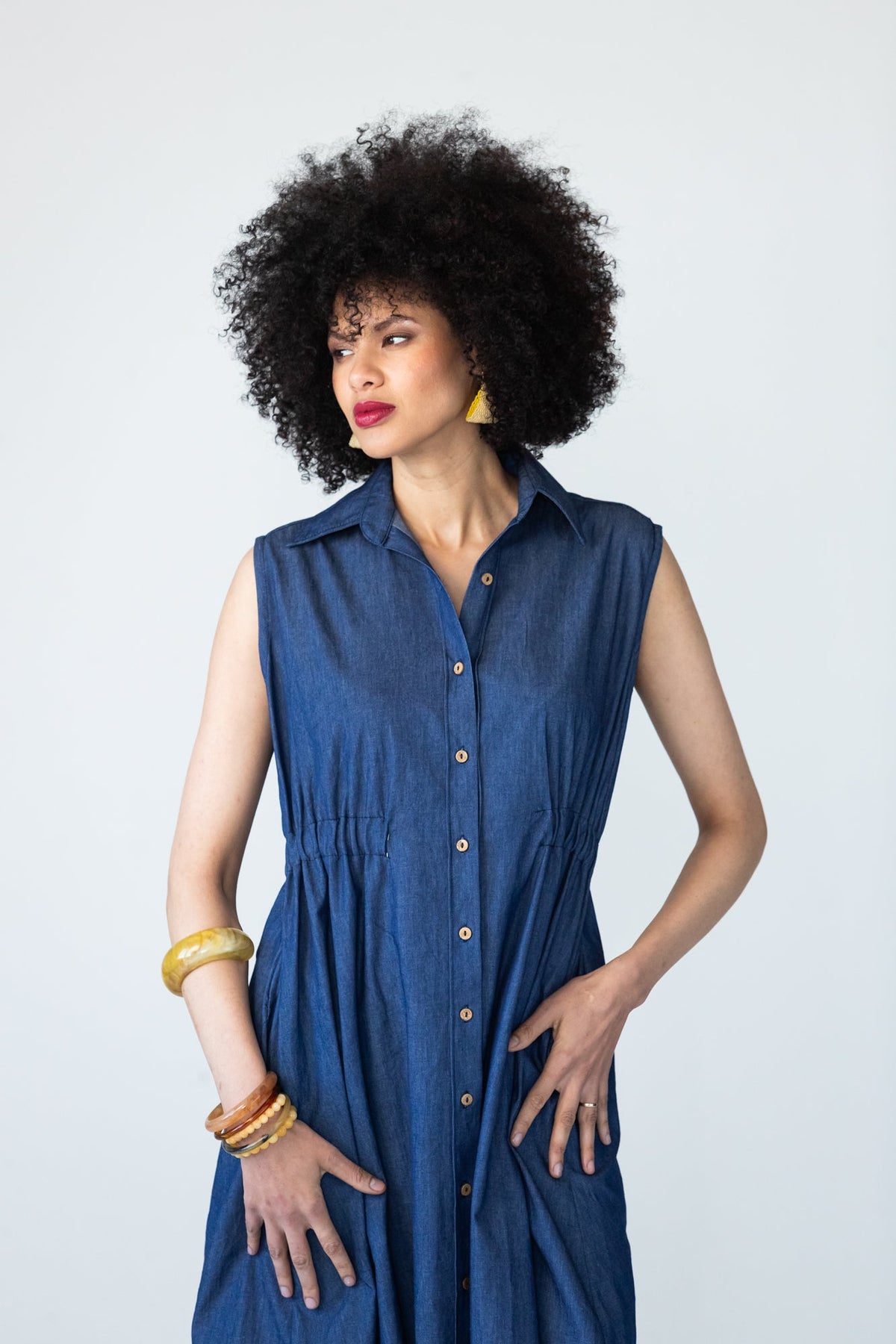 Sutton denim shirt-dress, three-quarter front view showing collar, button placket and elasticated waist