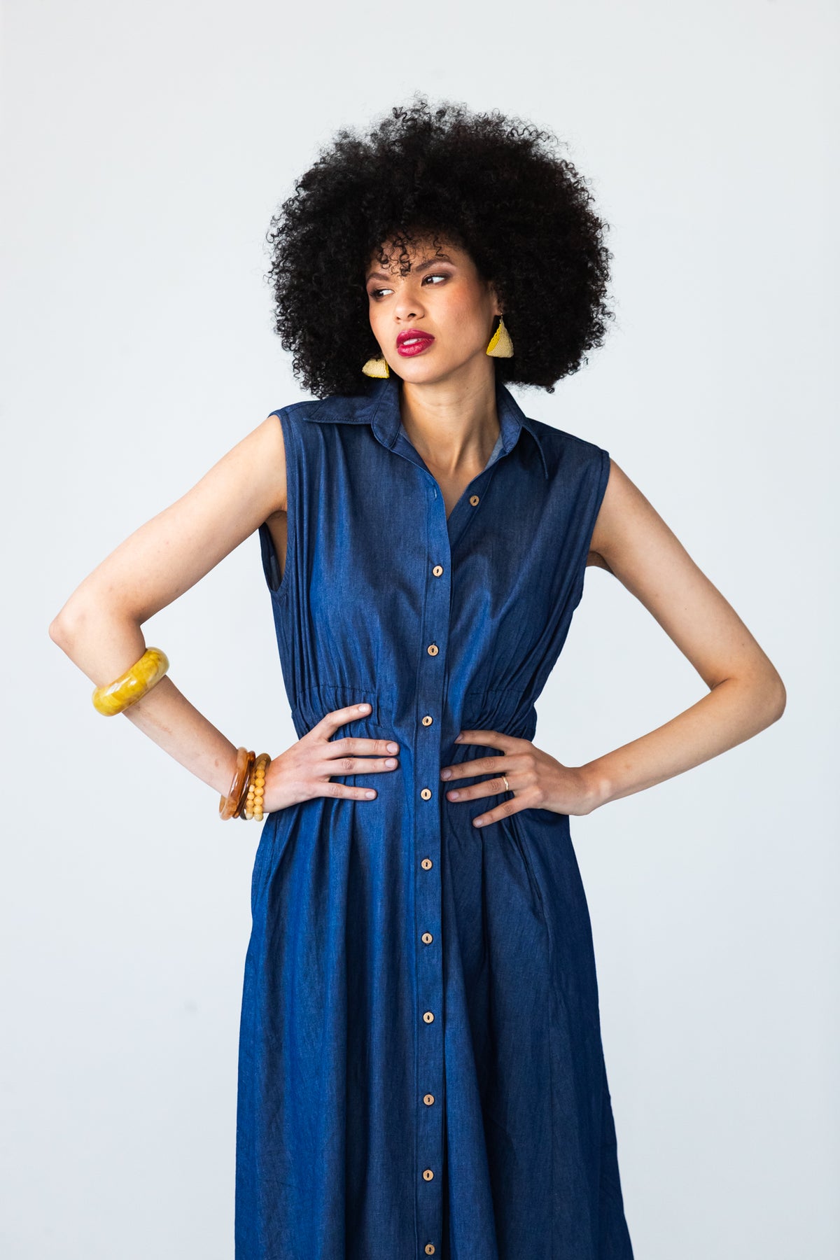 Sutton denim shirt-dress, front view with hands on hips at the elasticated waist