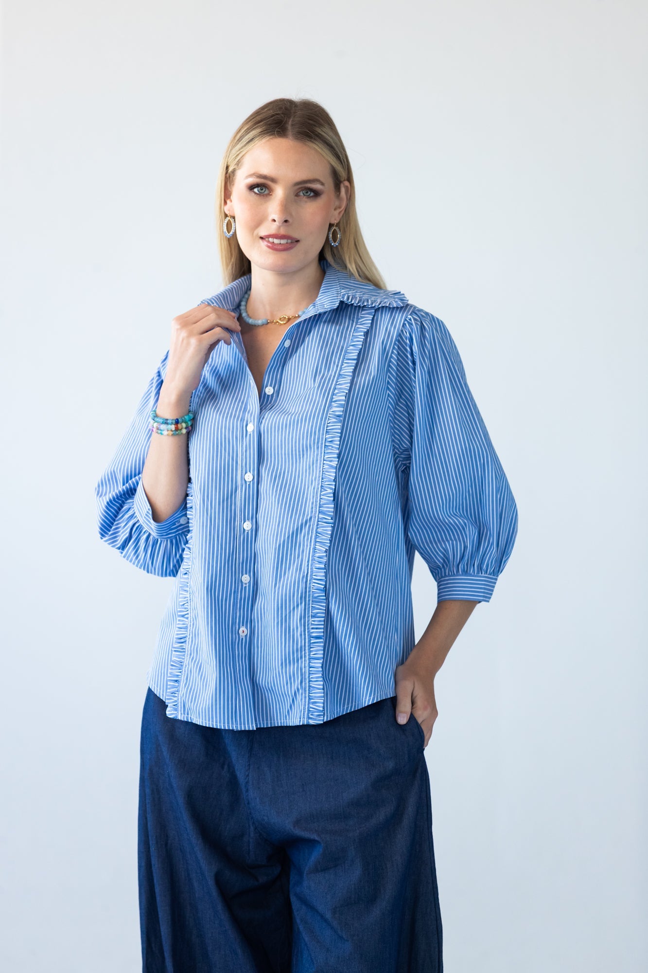Claire frill stripe shirt, front view with hand at collar