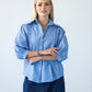 Claire frill stripe shirt, front view with arms crossed, close up