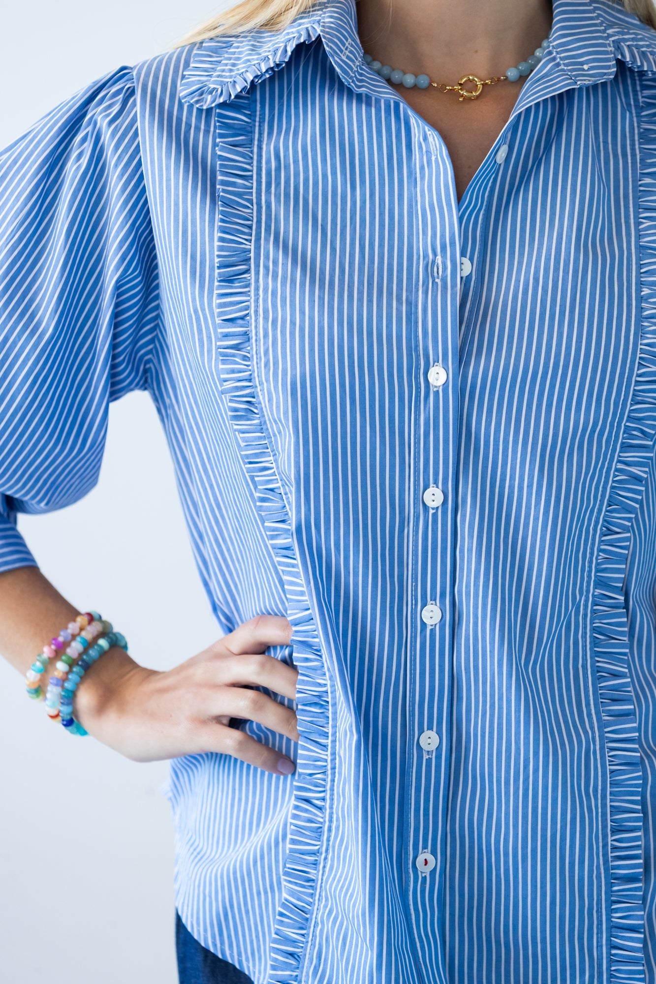Claire frill stripe shirt, close up of frill trim and button stand