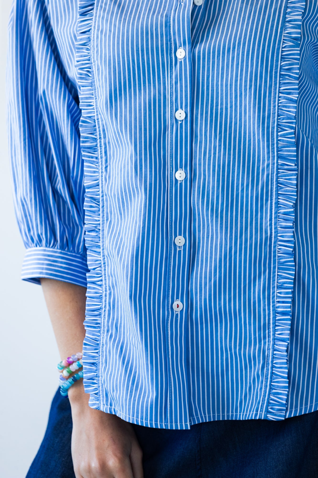 Claire frill stripe shirt, close up of frill trim and buttons